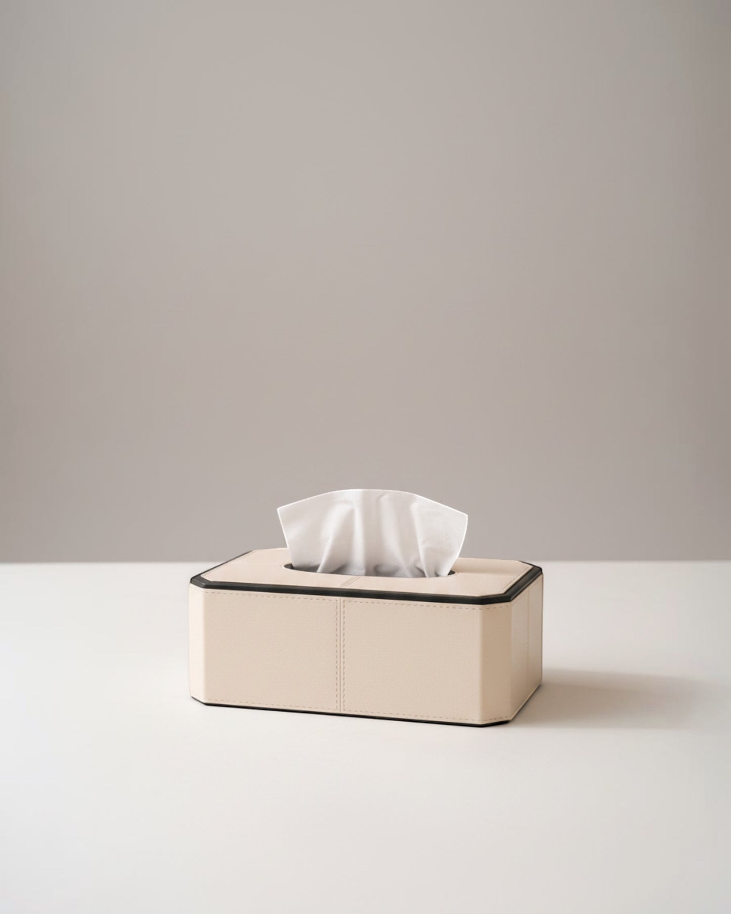 Kra Design Celeste Luxury Leather Tissue Box in cream with black trim. Minimalist design, durable, anti-mildew, odour resistant, water repellent.
