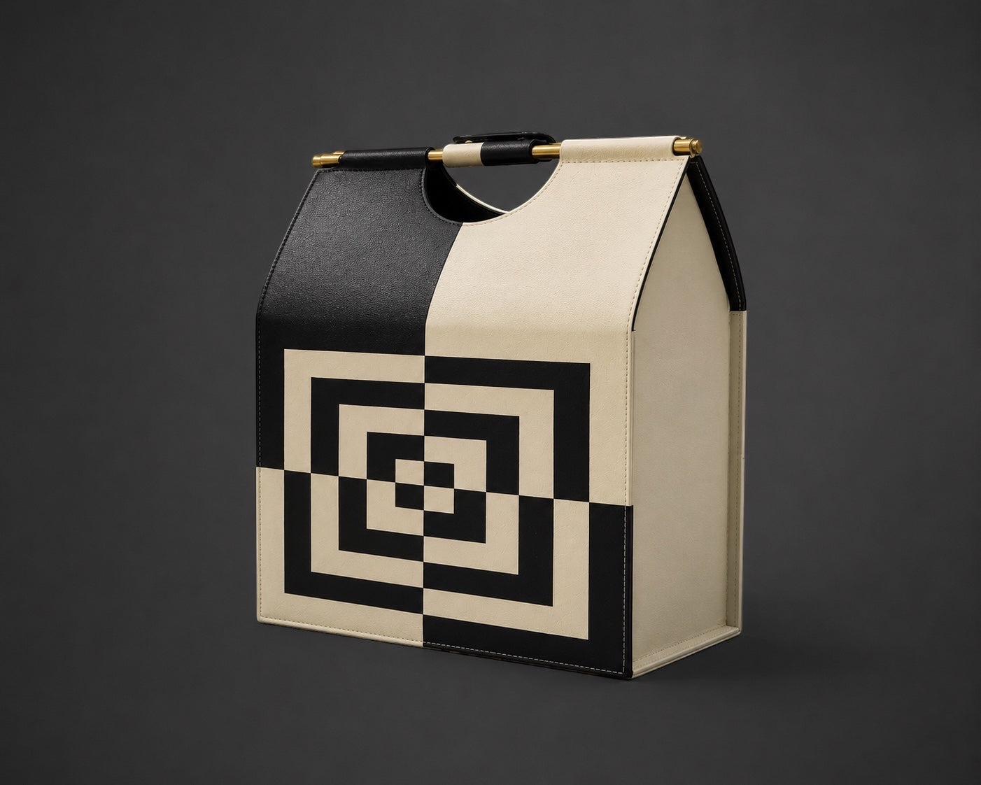 Kra Design black and cream geometric leather lunch basket with gold hardware and top handle.