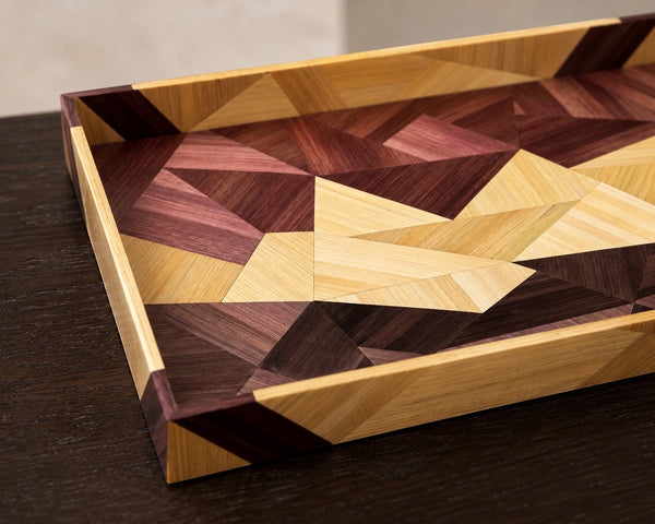 Kra Design geometric straw inlay decorative tray with warm wood tones and intricate mosaic pattern.