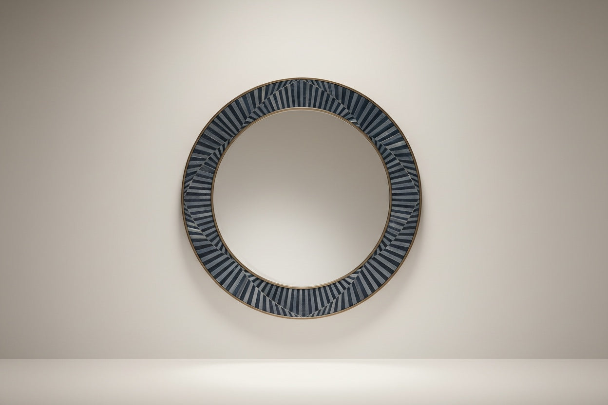 Kra Design round inlay mirror with a decorative geometric frame in dark blue and light blue segments.