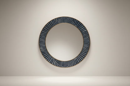 Kra Design round inlay mirror with a decorative geometric frame in dark blue and light blue segments.