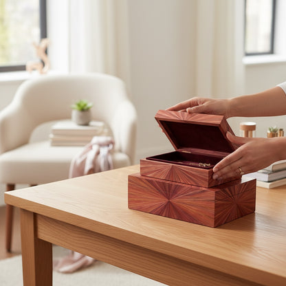 Kra Design luxury handcrafted jewelry box in straw marquetry with a sunburst pattern, opening to reveal a burgundy ultra suede interior.